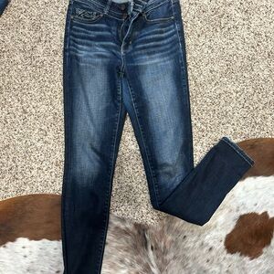 Buckle black skinny jeans